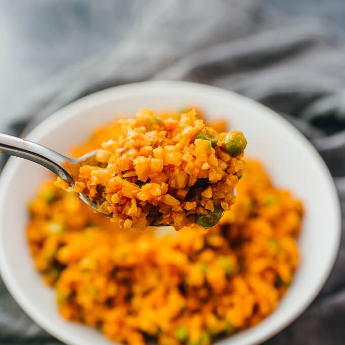 lifting up a spoon filled with mexican rice