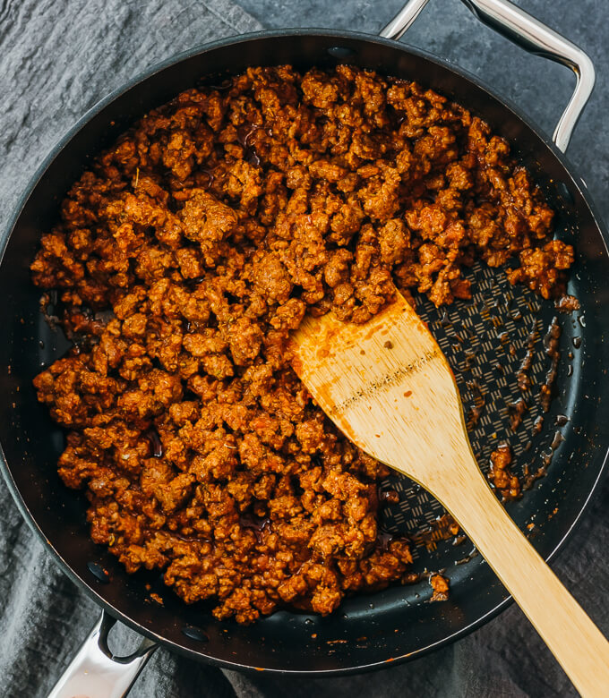 cooking tomato beef mixture in pan