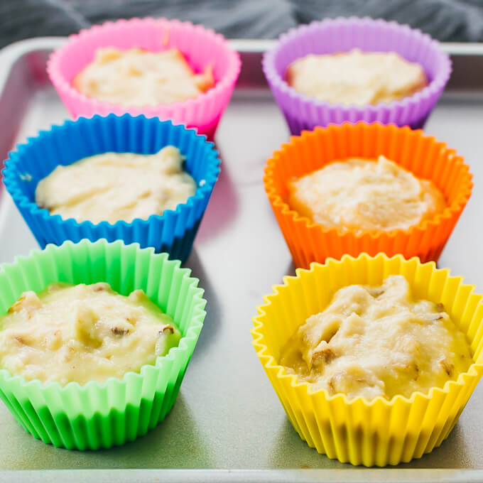 banana muffin batter in muffin molds