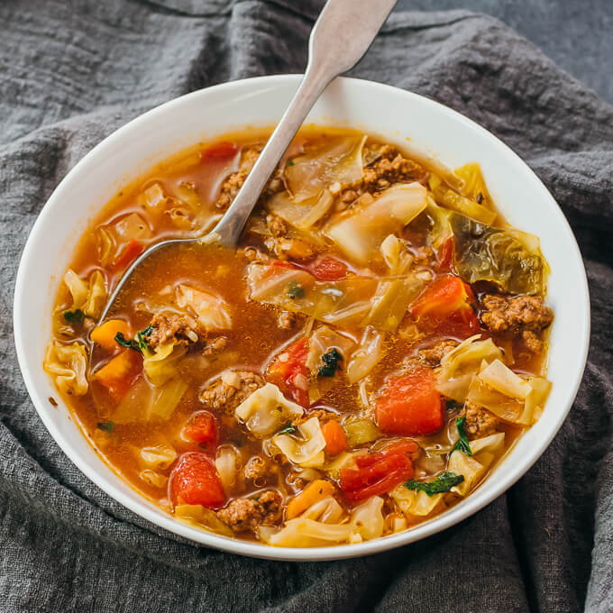 cabbage soup served in white bowl