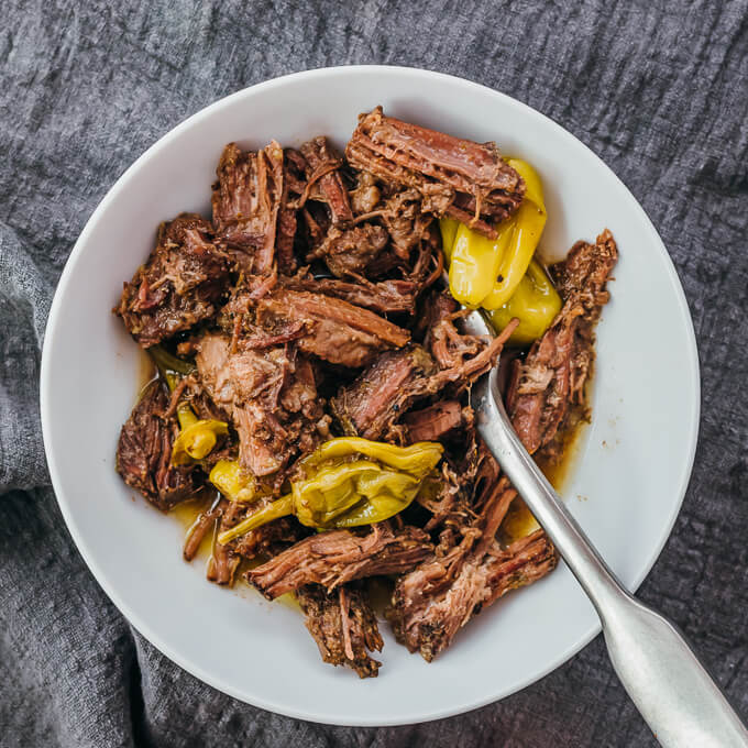 shredded beef pot roast served in white bowl