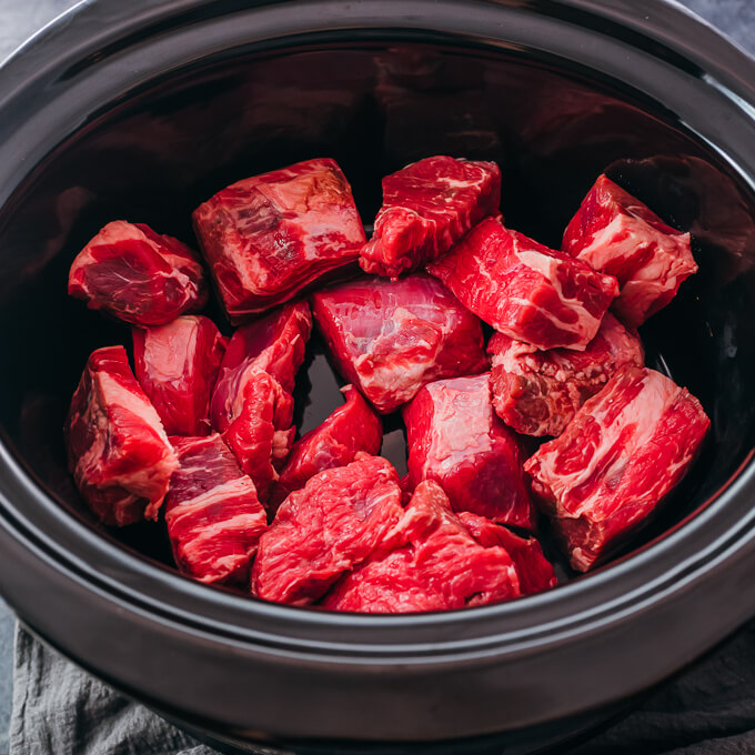 raw beef chunks in slow cooker