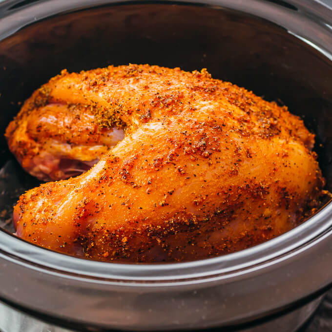 raw turkey breast rubbed with spices