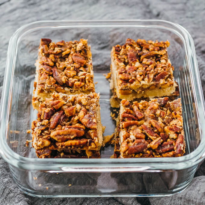 pecan bars stored in glass container