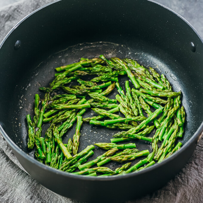 cooking asparagus tips in pot