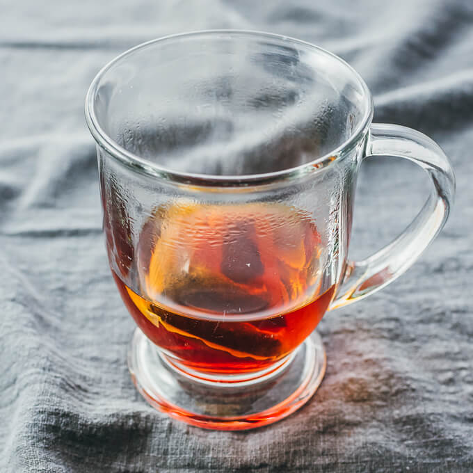 hot tea steeping in glass cup