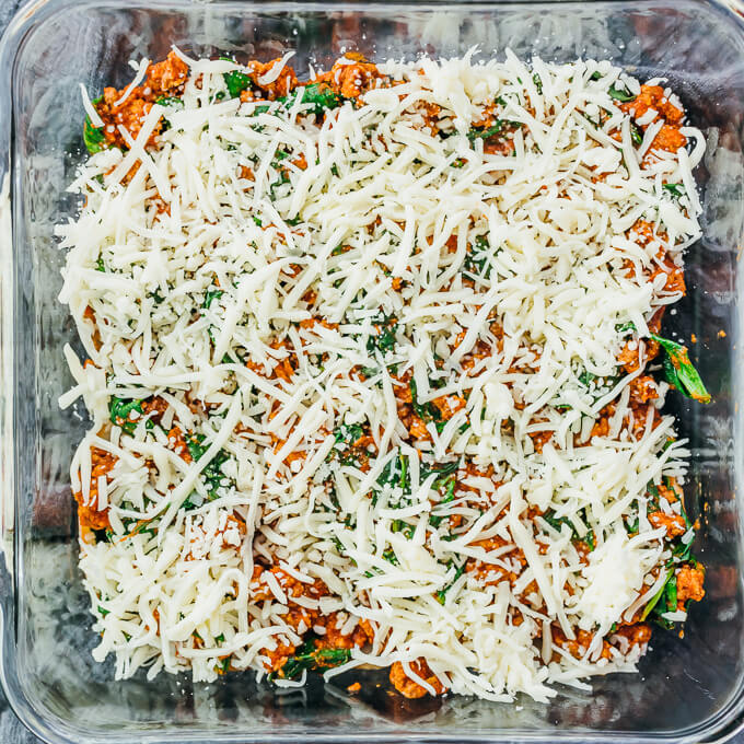 shredded mozzarella cheese in baking dish