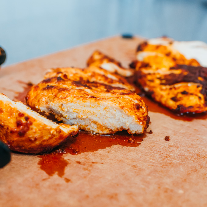 chicken breasts on a cutting board