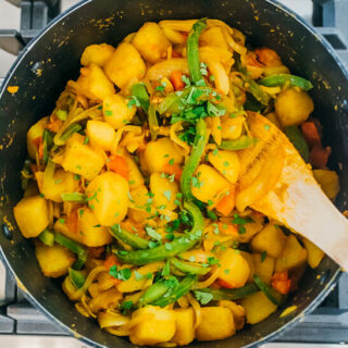 cooking potato curry in pot